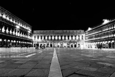 Facade of illuminated building at night