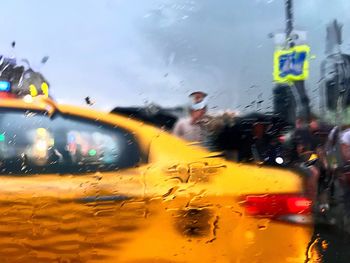 Blurred motion of cars on city street against sky
