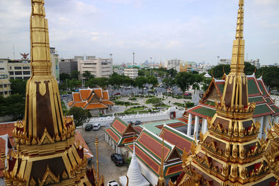 Panoramic view of buildings in city against sky