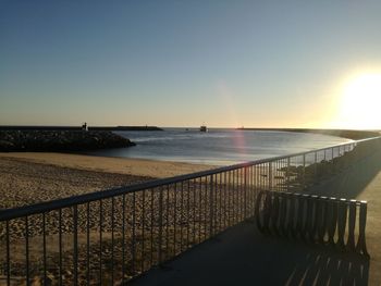 Scenic view of sea against clear sky during sunset