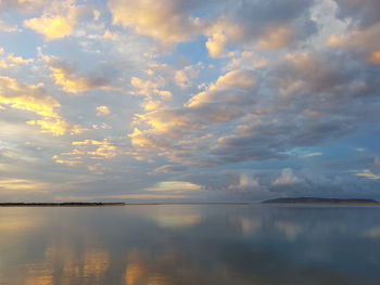 Scenic view of lake against sky during sunset