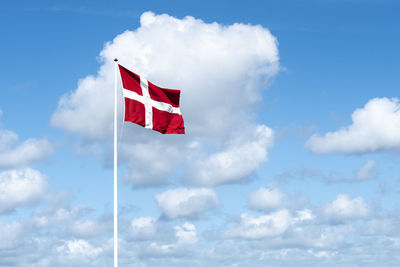 Low angle view of flag against sky