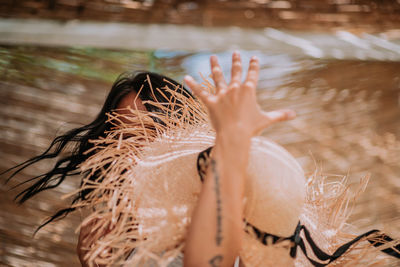 Low section of woman by lake