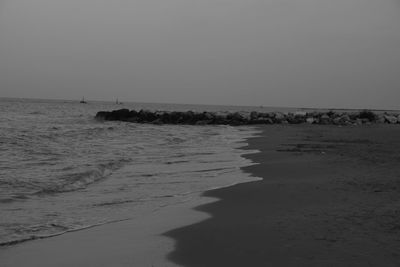 Scenic view of beach against clear sky