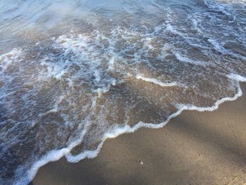 High angle view of surf on beach