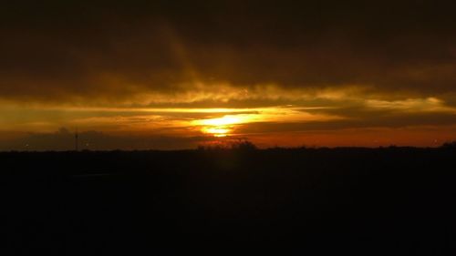 Scenic view of dramatic sky during sunset