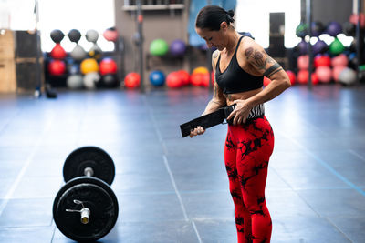 Side view of man exercising in gym