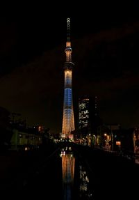 Illuminated buildings in city at night