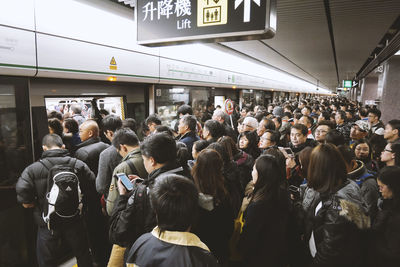 Group of people at railroad station platform