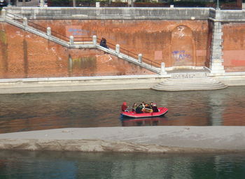 People on boat in river