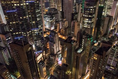 Aerial view of city lit up at night