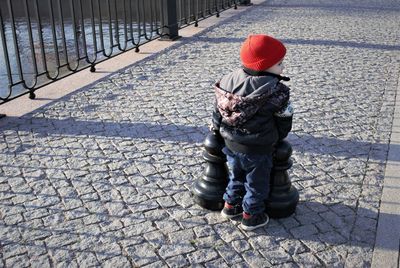 Full length of boy with umbrella