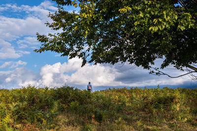 Man on field against sky