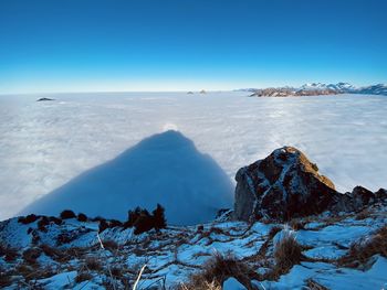 Scenic view of sea against sky during winter