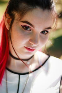 Close-up portrait of a smiling young woman