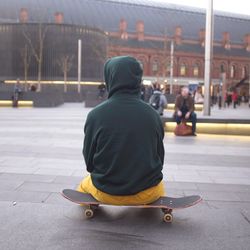 Rear view of man sitting in bus