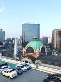 View of modern buildings in city against sky