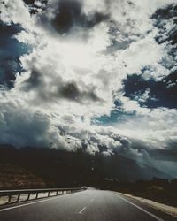 Road against cloudy sky