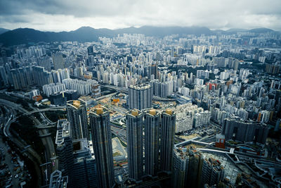 High angle view of modern buildings in city against sky