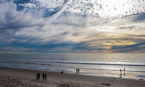 Scenic view of beach against sky during sunset