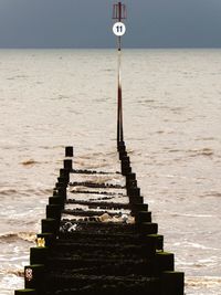 Abandoned pier in sea