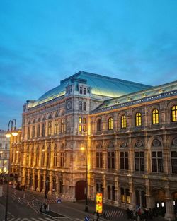 Buildings in city at dusk