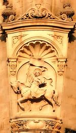 Low angle view of cross sculpture at temple