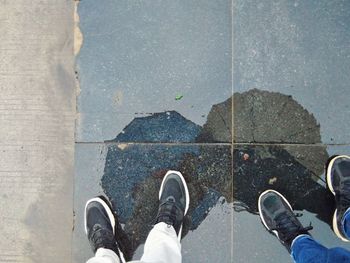 Low section of man standing on floor