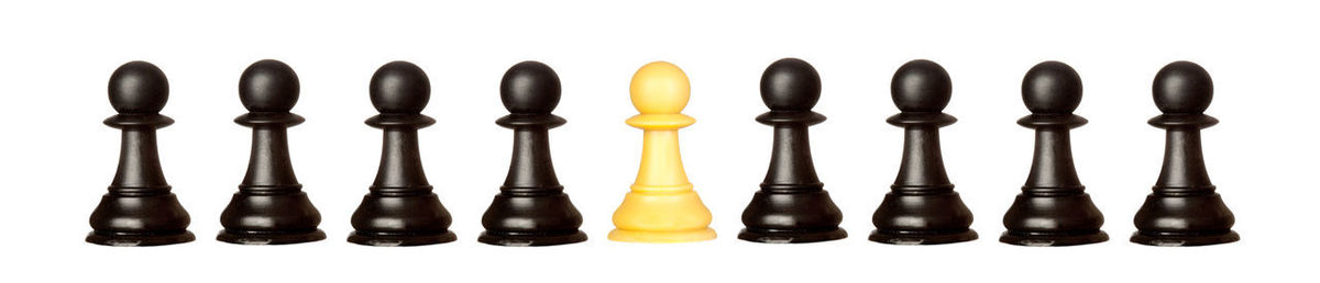 Close-up of chess board against white background