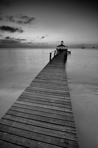 Pier over sea against sky