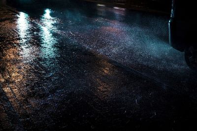 Low section of illuminated wet puddle