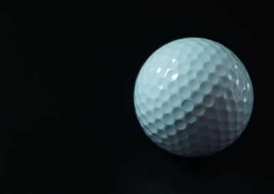 Close-up of ball against black background