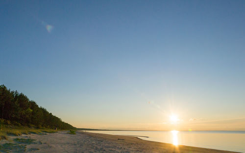 Scenic view of sea at sunset