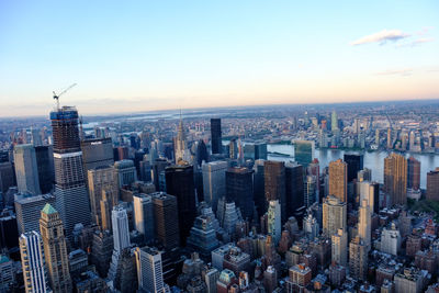 Aerial view of modern buildings in city against sky