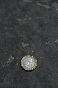 Close-up of coin on floor