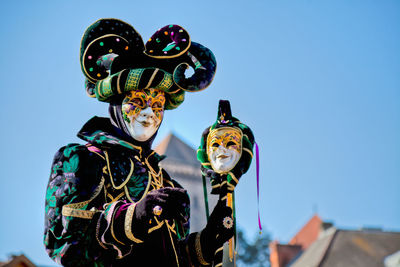 Low angle view of a mask in the dark