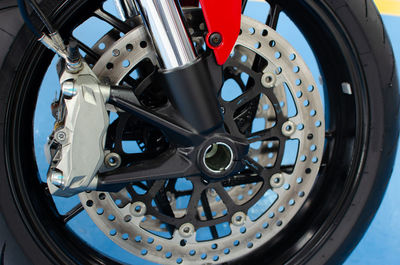 Close-up of motorcycle tire against blue background