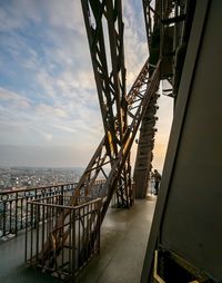 Bridge over sea against sky during sunset