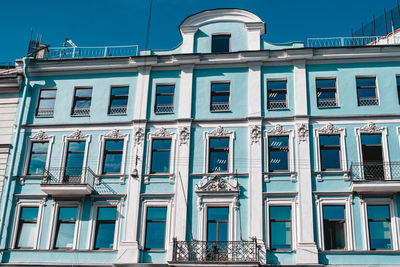 Low angle view of building against blue sky