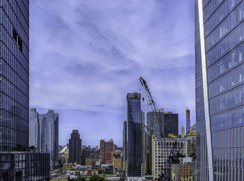 Modern buildings in city against sky