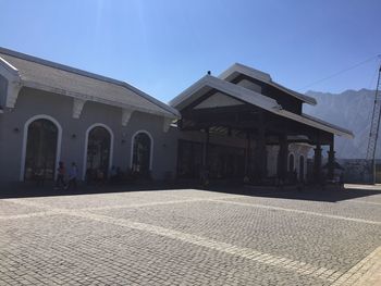 Facade of building against clear blue sky