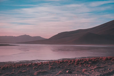 Scenic view of lake against sky during sunset