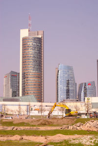 Modern buildings against clear sky in city