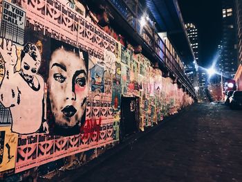 Graffiti on illuminated city at night