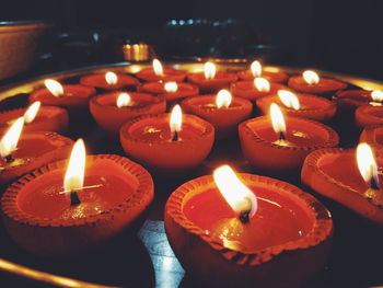 High angle view of illuminated candles burning