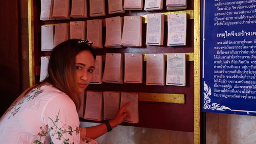 Portrait of woman looking at book