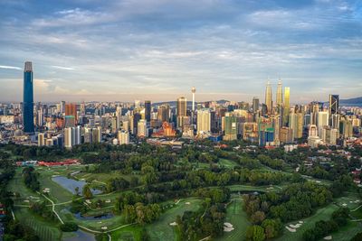 High angle view of buildings in city against sky