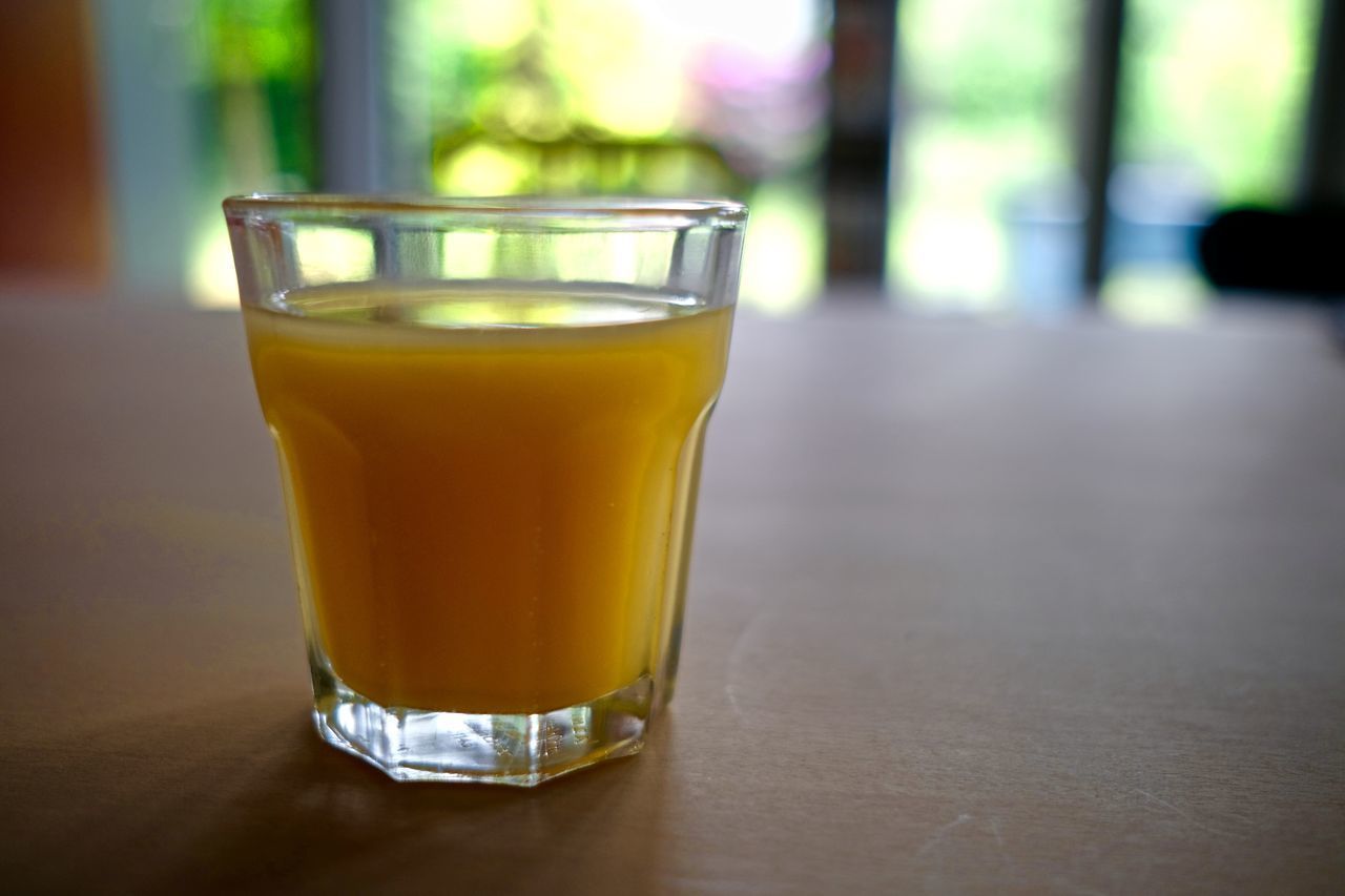 CLOSE-UP OF DRINK IN GLASS