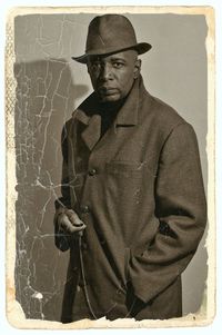 Portrait of man wearing hat standing outdoors