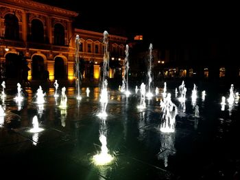 Reflection of illuminated buildings in water